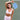 Model_holding_a_blue_checkered_Pulse_Pickleball_paddle_on_court_showcasing_stylish_paddle_design_and_white_activewear - Pulse Pickleball