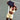 Person_holding_a_pickleball_paddle_with_Pulse_branding_on_a_tennis_court - Pulse Pickleball