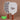 Two_pickleball_paddles_with_checkered_and_solid_designs_accompanied_by_green_pickleballs_on_a_brown_background. - Pulse Pickleball