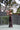 Woman_holding_a_pink_paddle_and_white_ball_on_a_pickleball_court - Pulse Pickleball