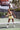 Woman_playing_pickleball_with_pulse_pickleball_on_an_outdoor_court - Pulse Pickleball