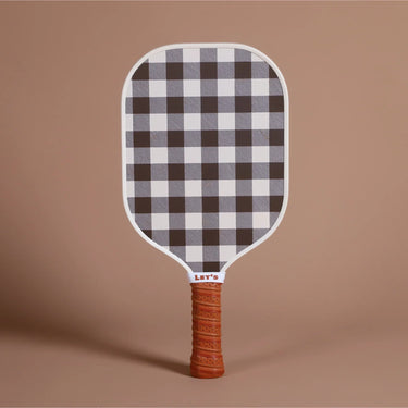 Fibreglass pickleball paddle with black and white checkered face and textured orange handle