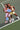 Two women on a pickleball court holding blue pickleball paddles.